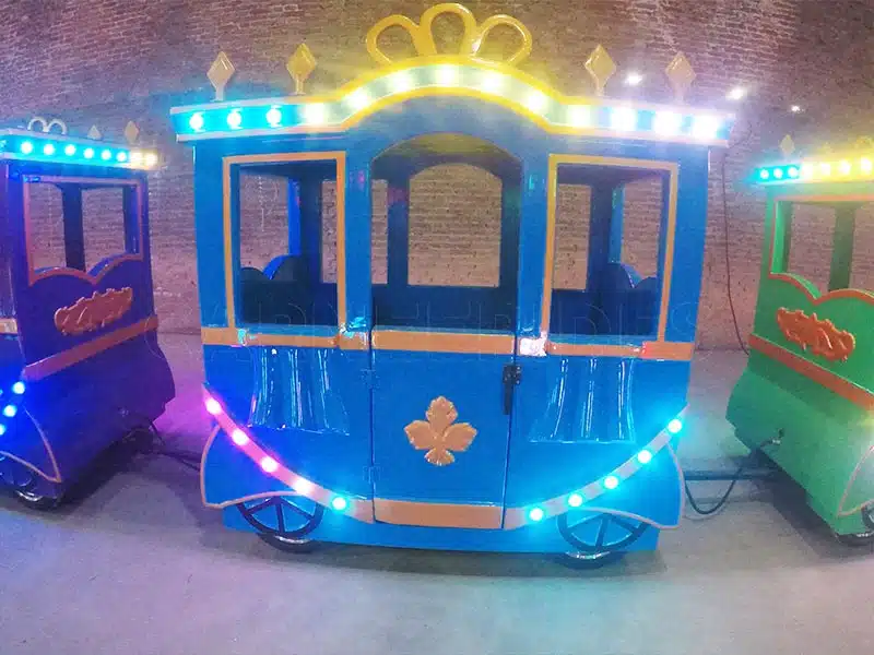 Close-up of the crown amusement train cabin with lights