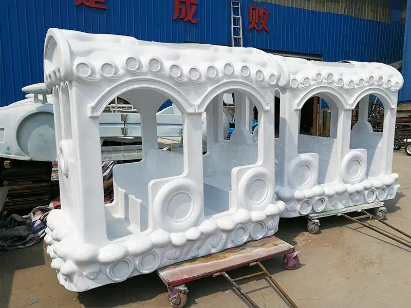 Trackless train cabins under production at Carnee Rides factory, made with high-quality fiberglass for durability.