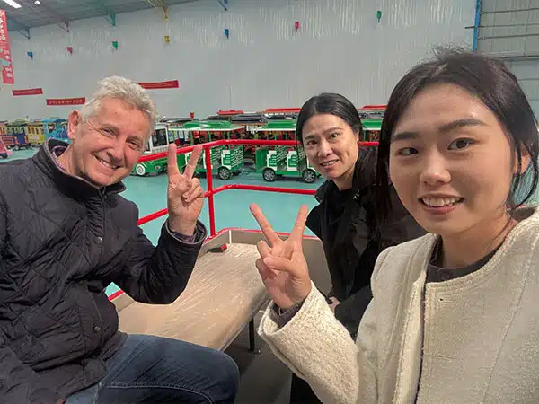 UK Customers taking a selfie while visiting Carnee Rides trackless train showroom