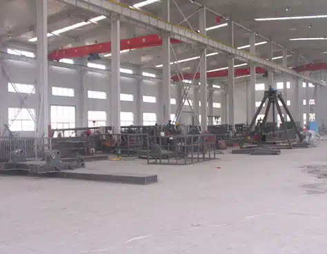 Early-stage Carnee Rides workshop producing amusement equipment structures