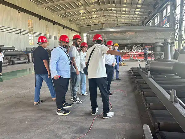 Somalia customer visiting Carnee Rides production workshop to inspect large amusement equipment