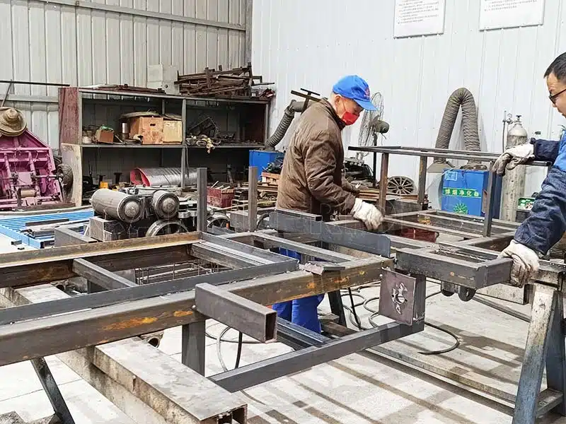 Heavy-duty steel frame welding for train rides, demonstrating durable structure and quality craftsmanship in factory production.