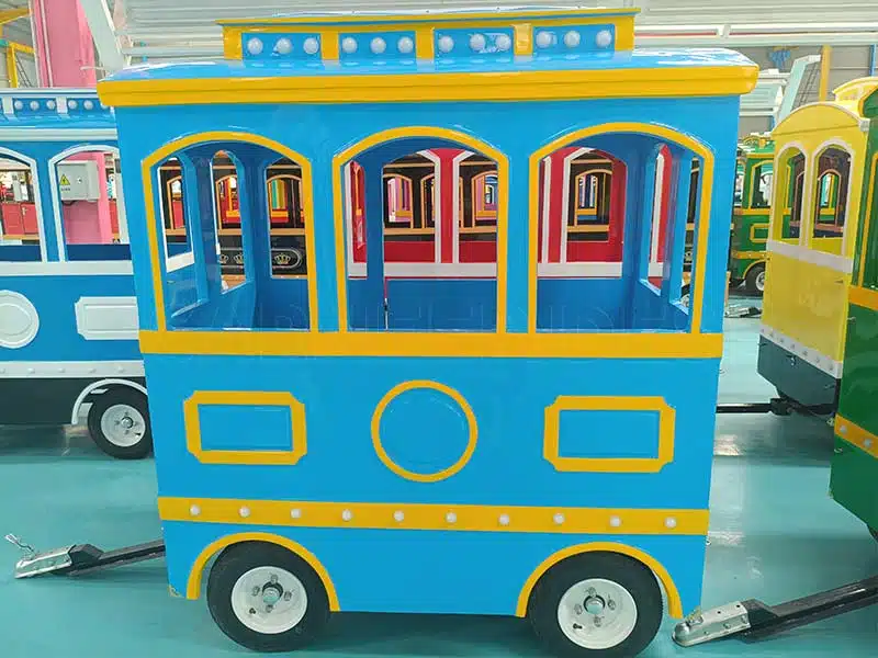 Fully painted and completed trackless train carriages ready for assembly.