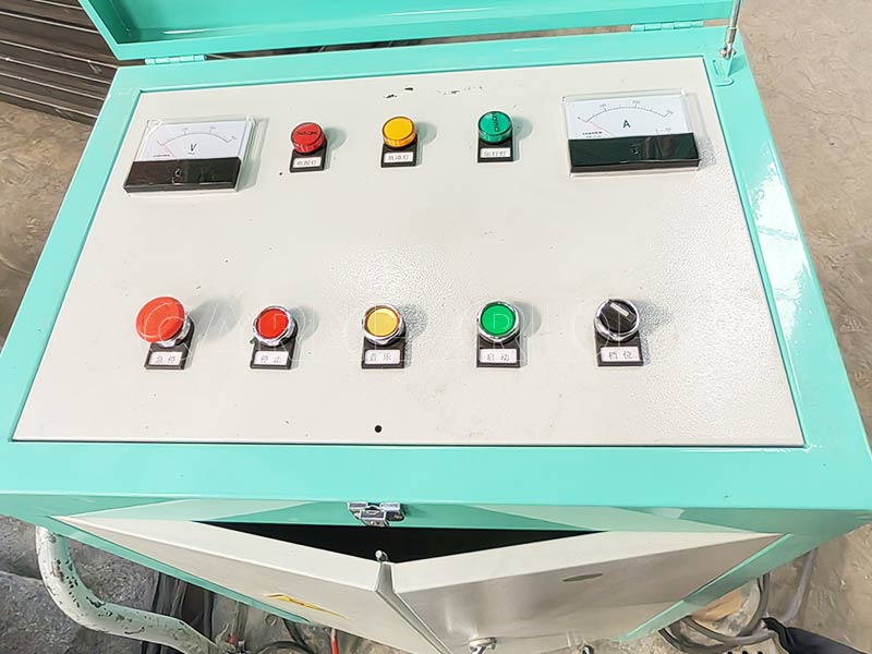 amusement bumper car control panel with voltage and current meters, featuring operator buttons for managing the bumper car power system.