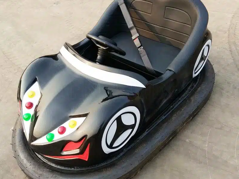 Black ceiling-powered bumper car featuring colorful front lights, durable FRP shell and overhead conductive pole for skynet bumper car systems.