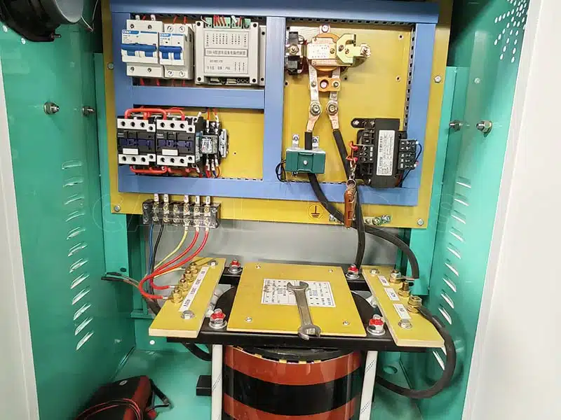 Internal structure of a bumper car power control cabinet, showing breakers, contactors, wiring, transformer and key electrical components for the ground grid bumper car system.