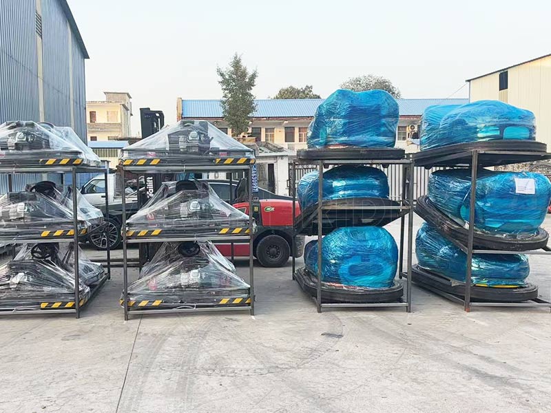 Bumper cars packed in metal racks and wrapped for export, prepared for worldwide delivery from the factory.
