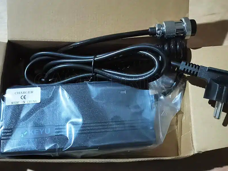 CE-certified smart 24V battery charger included with every commercial inflatable bumper car for safe and fast charging.