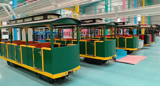 Trackless train carriage assembly line for amusement parks