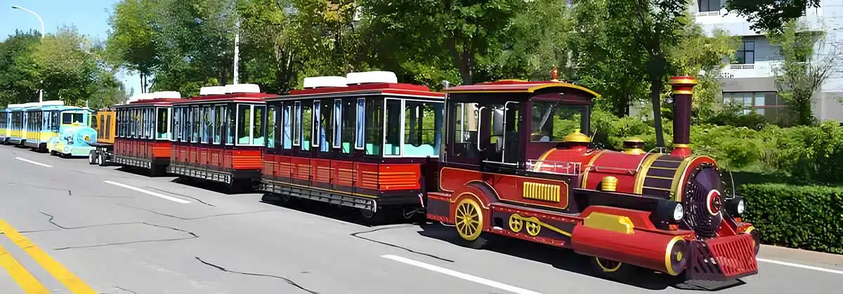 Red Classic Electric tourist road train operating on internal scenic roads, suitable for parks, resorts, and sightseeing routes