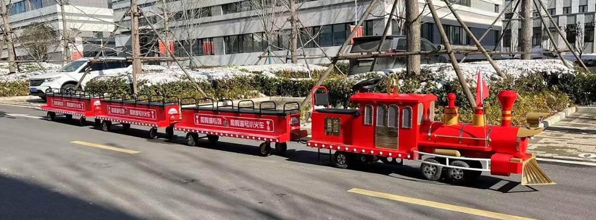 Tren comercial sin raíles utilizado en vías urbanas, tren eléctrico en miniatura montable para turismo urbano con sistema de batería de alta capacidad y rendimiento estable