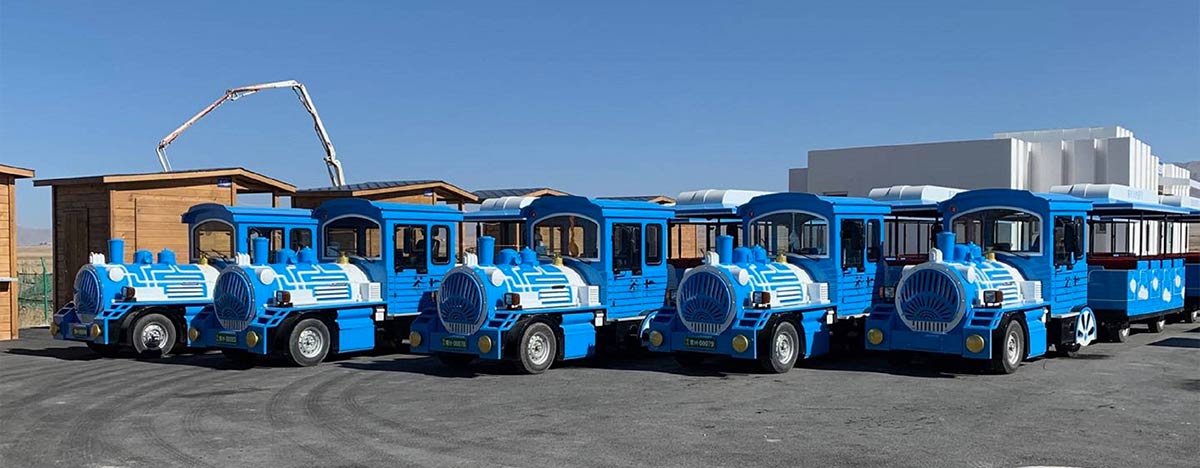 Amusement park trains for sale from factory with multiple blue tourist train sets
