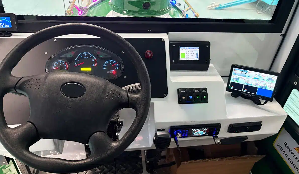 Trackless train control panel and dashboard with steering wheel monitor buttons and operation display