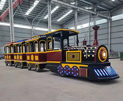 16-seat vintage-style commercial trackless train with black and gold locomotive and passenger carriages